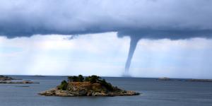 water spout near island